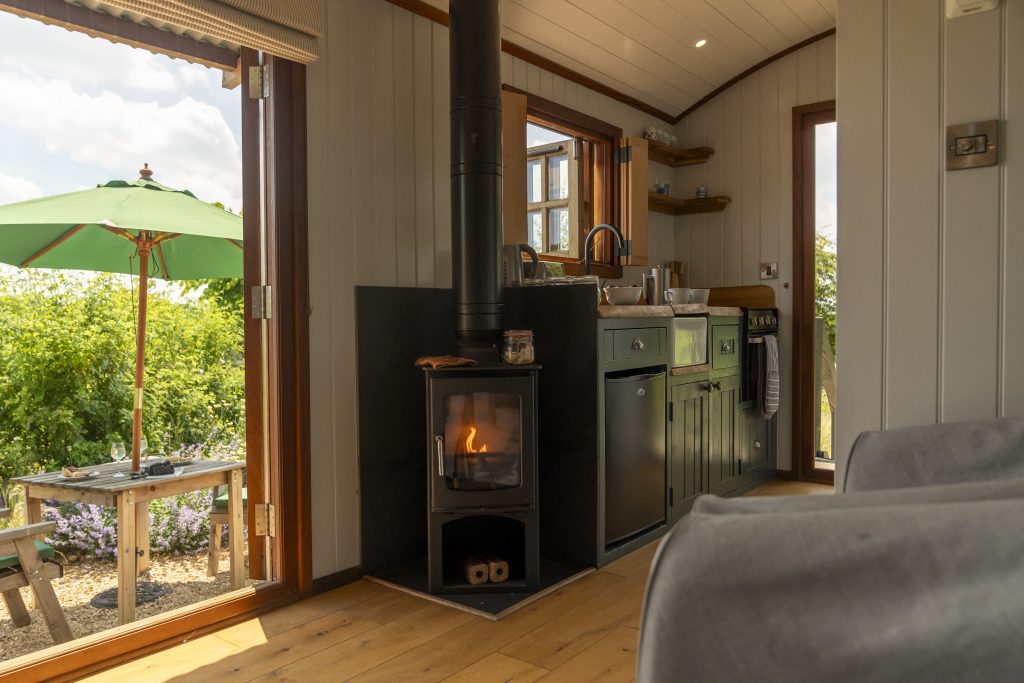 boutique-glamping-cabin-interior-woodburner
